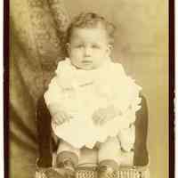 Cabinet photo of a baby posed in photographer