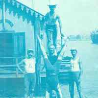 Oval cyanotype photo of 5 members of the Atlantic Boat Club on the pier near the clubhouse, Hoboken, no date, ca. 1890.