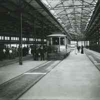 B+W photo of Public Service Railway Hudson PlaceTerminal loading platform with trolley/streetcar on the second floor, Hoboken, no date, ca. 1910.