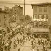 Sepia-tone photo of funeral procession at Fifth and Washington Streets, Hoboken, 1900.