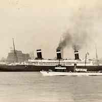 Image: S.S. Leviathan sailing south on the Hudson River, New York City in the background, 1935 (actually 1934).