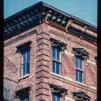          Color slide of detail view of cornice, brackets, frieze, window heads and brick quoins at 200 Washington on the NW corner with 2nd picture number 1
   