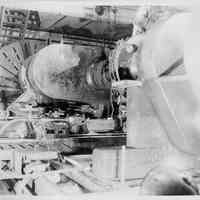 B+W photo of floor level view of a short crank shaft on large lathe machine shop, Hoboken, no date, ca. 1935-1940.