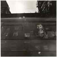 B+W photo of a painted Christ portrait in van window, Hoboken, no date, [1976].