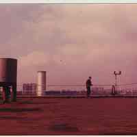 Digital images, 2, of Anton Peskens on rooftop of Maxwell House Coffee building & a rooftop vista, Hoboken, n.d., ca. 1980-1982.