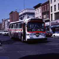 Color photo of Red Apple New York-Hoboken bus on Washington St. at Newark St., Hoboken, May 17, 1987.