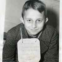 B+W photo of 9 year old Hans Hager arriving in Hoboken on S.S. Rotterdam of Holland America line, Dec. 2, 1939.