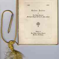          view of front cover with cord, pencil & tassel
   