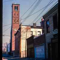          Color slide of eye-level view from Court between 3rd & 4th looking N at the bell tower of Saints Peter & Paul Catholic church picture number 1
   