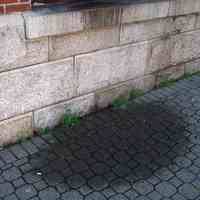          25: detail west facade of stone base, sidewalk
   