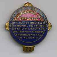 Color images of enameled badge worn by a sandhog working a caisson for Lincoln Tunnel, no date, circa 1934-1944.