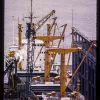 Color slide of close-up view of an unloader ship docked at Pier B on River between 2nd & 3rd