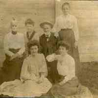 Sepia-tone group photograph of the Miller family, no place, no date, ca. 1890.