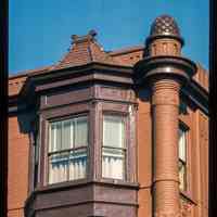          Color slide of close-up view of bay windows, brick turret and decorative tile at 801 Washington on the NE corner with 8th picture number 1
   