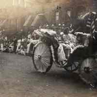 Sepia tone photo of 3rd Annual Hoboken Baby Parade, King & Queen royal carriage, on Garden between 10th & 11th Sts., Hoboken, Sept. 8, 1915.