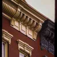 Color slide of detail view of cornice, brackets, frieze and window heads on a building between 923 and 933 Garden between 9th and 10th.