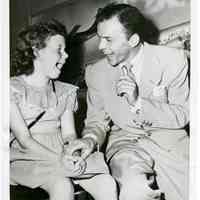 Sinatra photo: Frank Sinatra with young fan Ruth Aase at Idlewild Airport, N.Y., after returning from London, July 25, 1950.