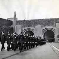 B+W photo of Lincoln Tunnel police force marching in N.J. plaza 3 days prior to opening, Weehawken, Dec. 18, 1937.