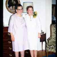 Color slide of a two women standing in a room.