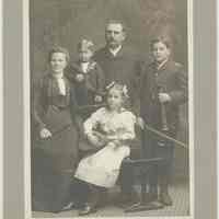 B+W group photo of a Hoboken family in a studio portrait holding musical instruments, Hoboken, no date, ca. 1910.