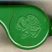 Official Girl Scout whistle, belonging to Catherine Rochavansky, Hoboken Girl Scouts. No date, ca. 1960-80. Green molded plastic with black lanyar