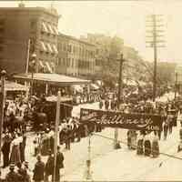 Sepia-tone photo of a funeral procession on the 400 block of Washington St. for victims of the 1900 Hoboken pier fire, Hoboken, July-August, 1900.