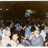 Color photo of supporters of mayoral candidate Tom Vezzetti in front of City Hall on election night, Hoboken, [June 11, 1985].