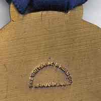          detail maker's mark on reverse of medal
   