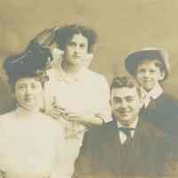 Photo postcard of Florence & Madeline Miller with a man and young boy, no place, no date, ca. 1920.