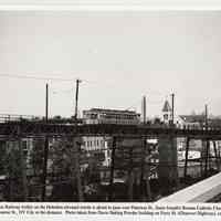 B+W photo of streetcar on elevated trestle in southwest Hoboken; St. Joseph