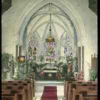 Lantern slide, color, of a church interior with floral decorations, used for promotional display in Hoboken, no date, ca. 1920.