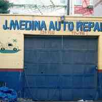 Color photo of painted sign on wall for J. Medina Auto Repair, near Jefferson and Fourth Sts., Hoboken, Jan. 3 & 4, 2002.