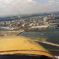 Color aerial photos, 2: wide view of Hoboken from south; Exchange Place, Colgate Clock, Paulus Hook, Jersey City, n.d. 1990.