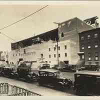 Sepia-tone photo of exterior brickwork and roof completion for the Fabian Theatre, Newark & Washington Sts., Hoboken, April 3, 1928.