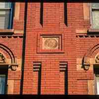          Color slide of detail view of decorative tile, brick pilasters and semicircular arches on the façade of 819 and 821 Washington between 8th and 9th picture number 1
   