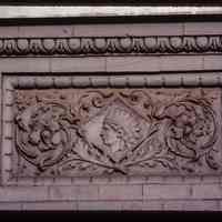 Color slide of close-up view of decorative tile on a building on Washington between 11th and 12th