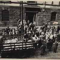 B+W photo of men moving City of Hoboken records on Newark St. side of City Hall, ca. June, 1947.