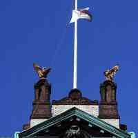          199: Hoboken City Hall, 94 Washington St; detail flagpole, eagle ornaments
   