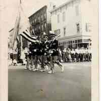 Digital image of b+w photo of Our Lady of Grace Fife & Drum Corp color guard marching, Hoboken, no date, ca. 1945-1950.