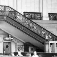          detail right of center: Bar, Lounge Liquor sign above door beneath stairway
   