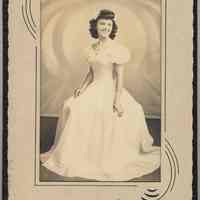 Sepia tone photo of Mildred Avantario posed for graduation photo, Hoboken, n.d, ca. May -June 1943.