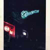 Color image of night exterior view of the Shannon Bar, Hoboken, 1978.