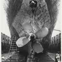 B+W photo of MV Grand Justice, stern view, in dry dock at Bethlehem Steel Shipyard, Hoboken, n.d., early Feb. 1975.