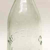 Bottle: Motel & Co., Cor. of 8th & Garden Sts., Hoboken, N.J. N.d., ca. 1910-1920.