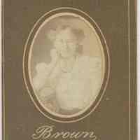 Sepia-tone photo of an unidentified young woman posed in studio, Hoboken, no date, ca. 1890-1910.