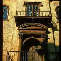          Color slide of close-up view of portico, railings, pediment and frieze reading 