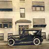 Digital image of sepia-tone photo of the exterior of 1210 Hudson Street with an automobile, Hoboken, 1923.