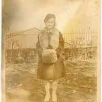 Sepia-toned photo of a young girl in winter coat taken in Elysian Park, Hoboken, no date, ca. 1924-1926.