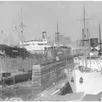 B+W photo of the S.S. Warrior in dry.dock; S.S. Darien in slip south of dry dock, Hoboken, no date, ca. 1940.