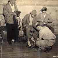 B+W photo of John J. Grogan et al being outfitted with U.S. Army uniforms, Fort Monmouth, N.J., no date, circa 1943.